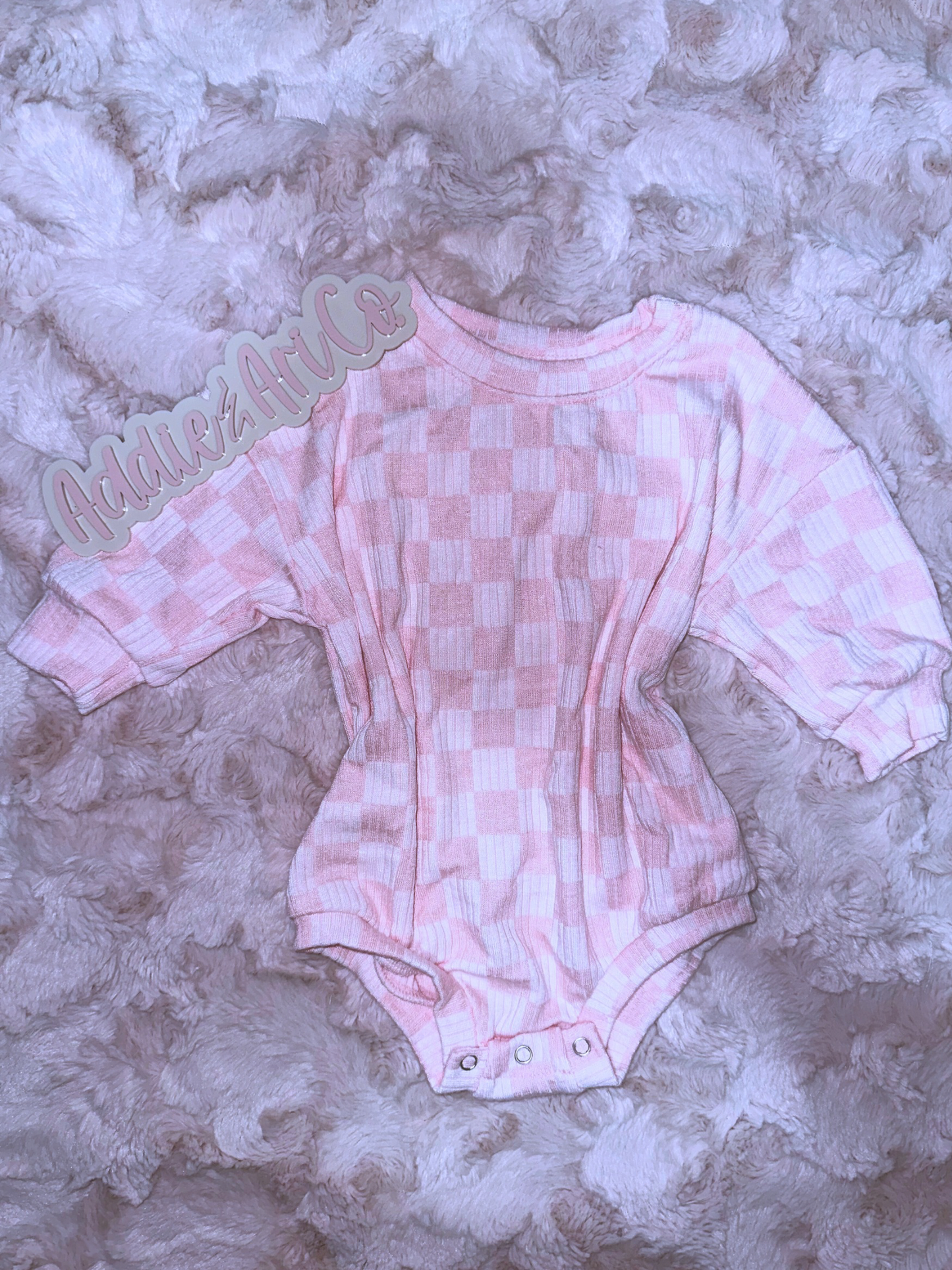Pink checkered sweater romper